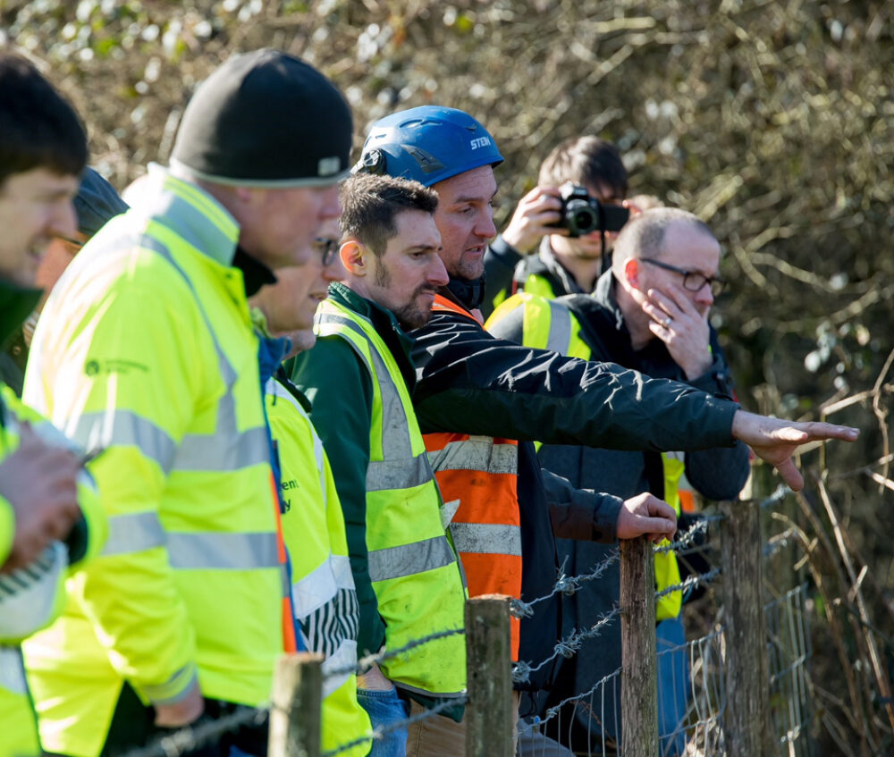 Contractors surveying area